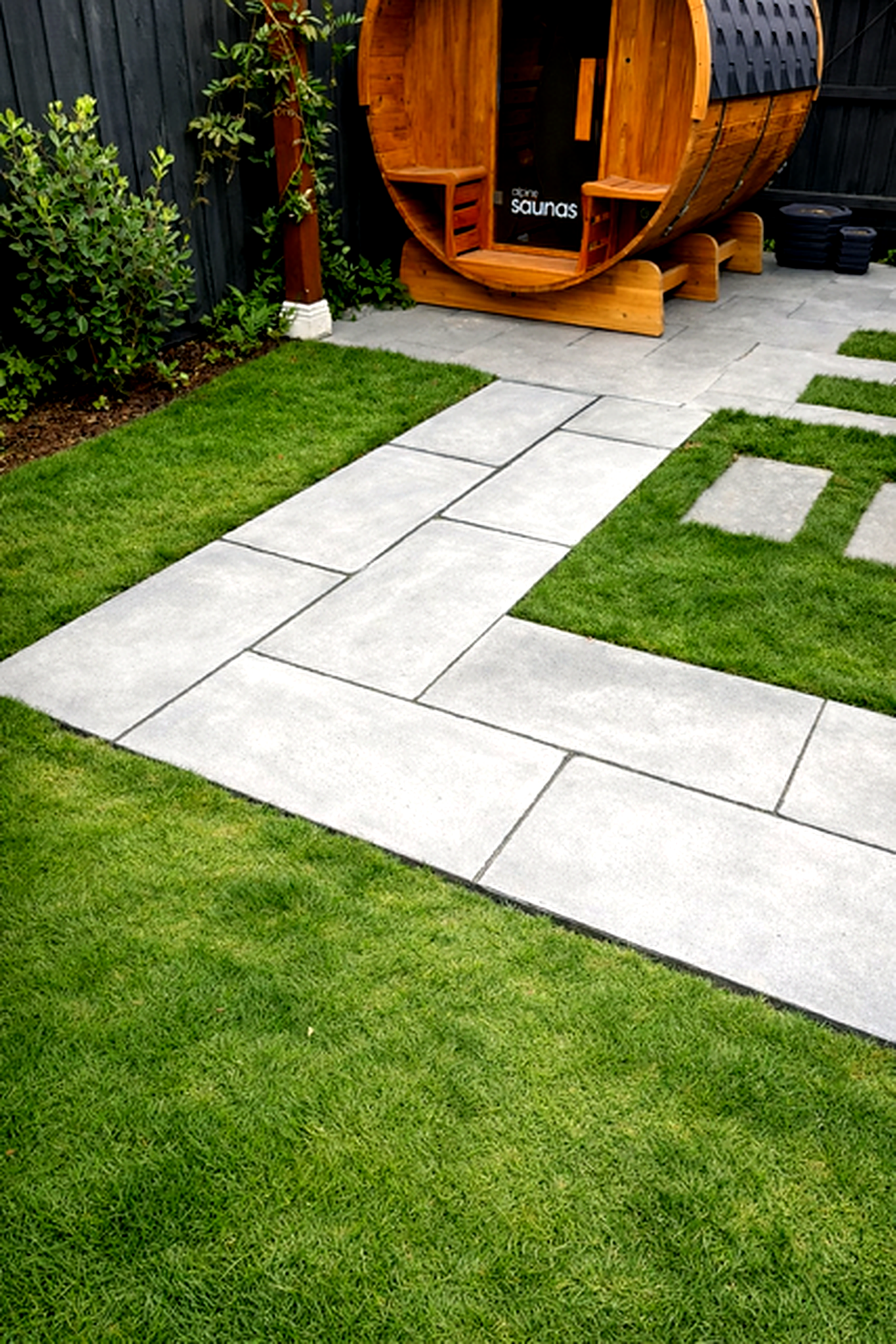 Bluestone paving pathway leading to barrel sauna set in turf, Yarraville